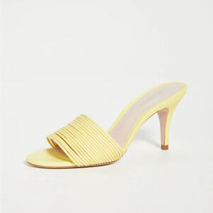 Schutz mules in lemon color. Size 6. 3.25” heel height.